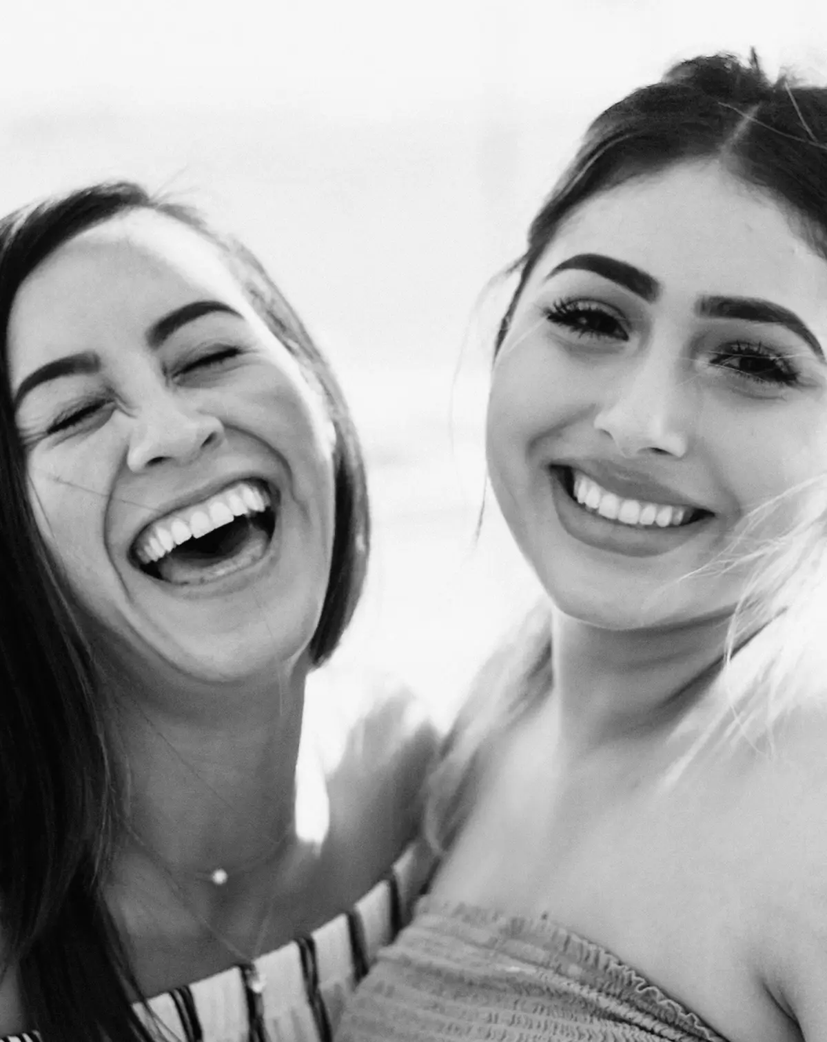 two smiling and laughing women