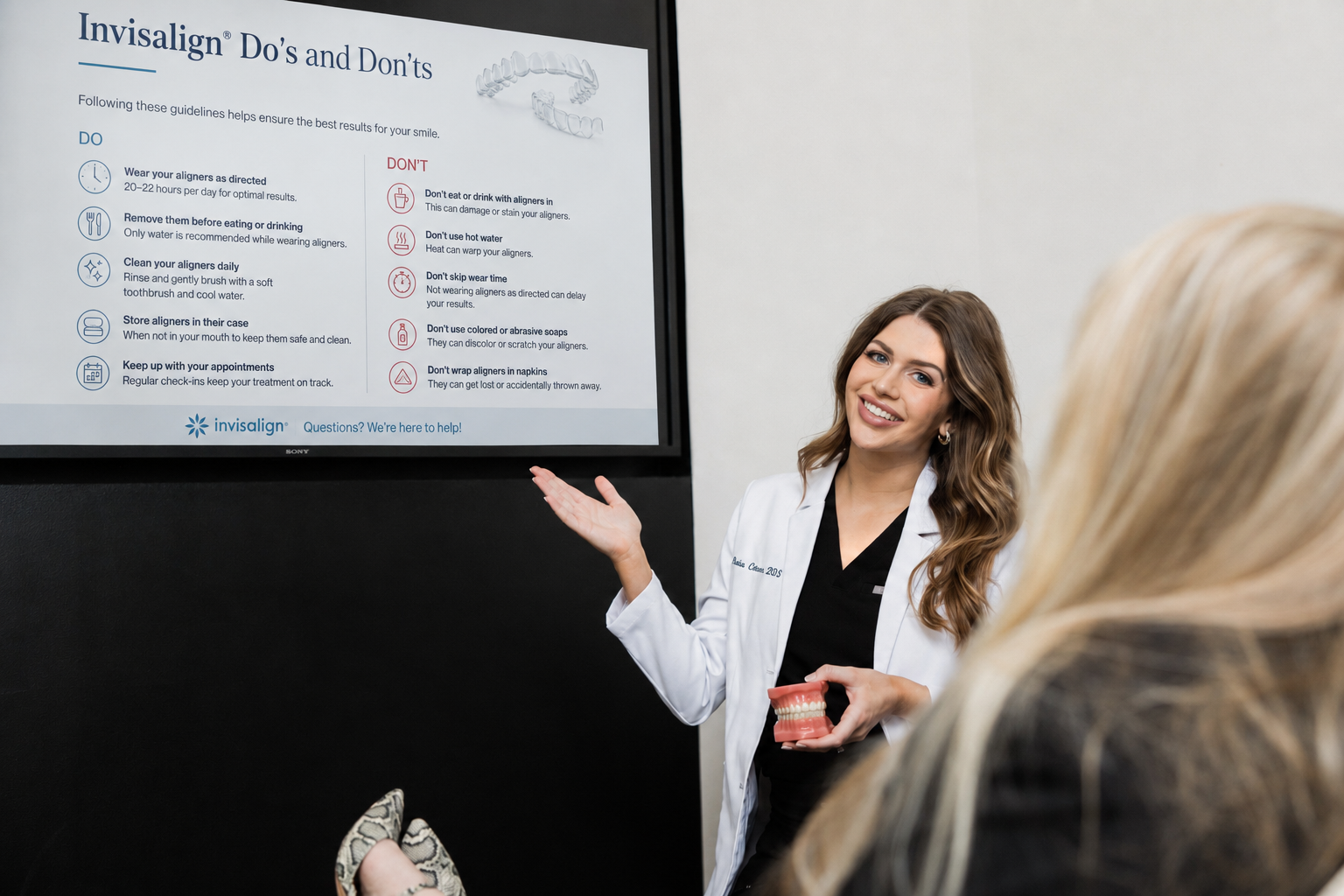 Dentist explaining Invisalign dos and don'ts to a patient during an orthodontic consultation at Smile Dailey Dental in West Little Rock